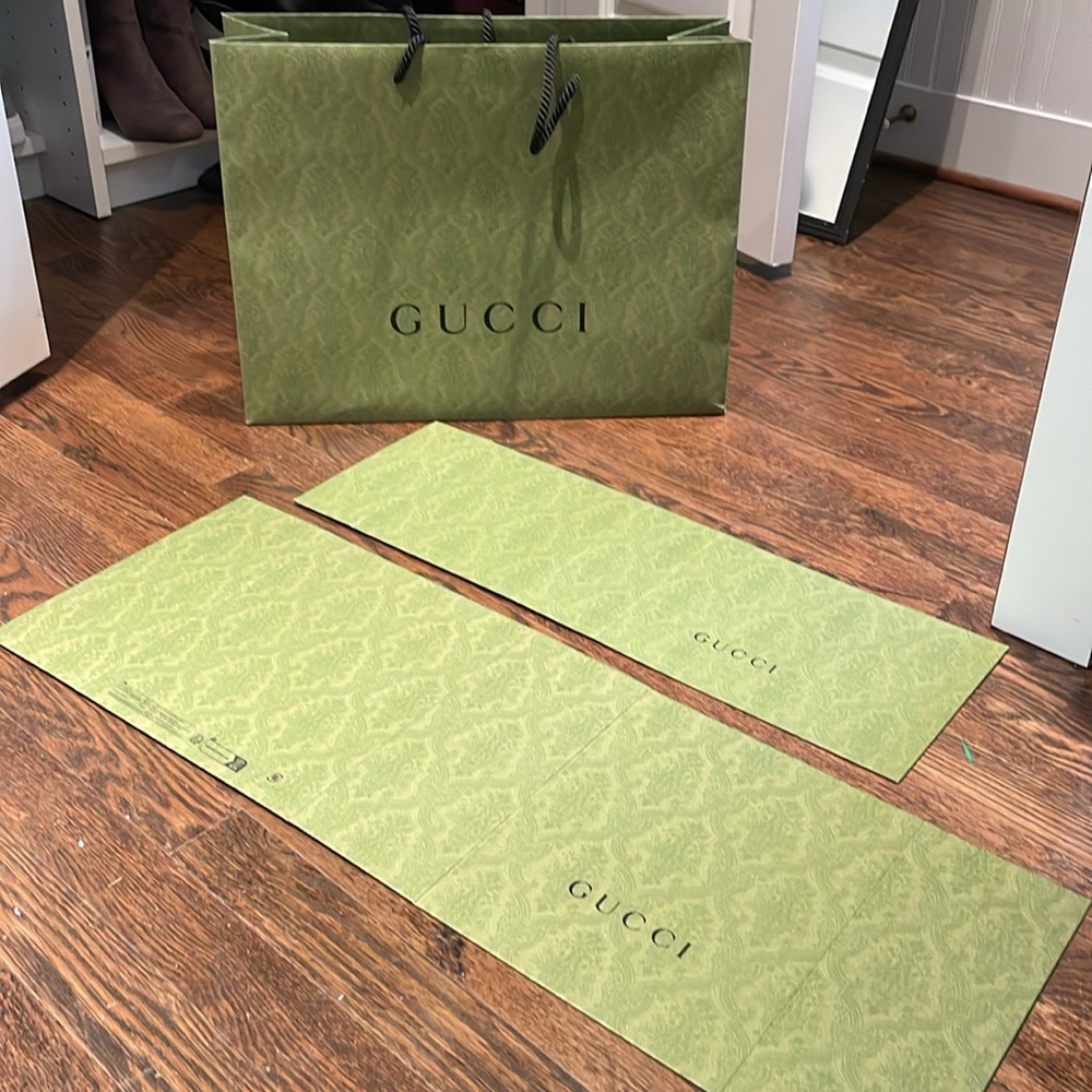 One authentic Gucci shopping bag and two authentic Gucci boxes